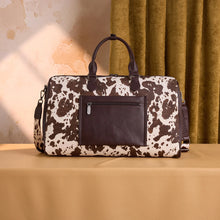 Load image into Gallery viewer, WG444-5110CF Wrangler Cow Print Fringe Duffle/Crossbody - Coffee
