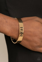 Load image into Gallery viewer, Hope Makes The World Go Round Paparazzi Inspirational Cuff Bracelet  - Gold
